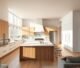 Modern open-concept kitchen design in the USA with island, quartz countertops, and natural lighting reflecting current kitchen trends