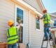 Professional siding installation services on a newly built residential home.